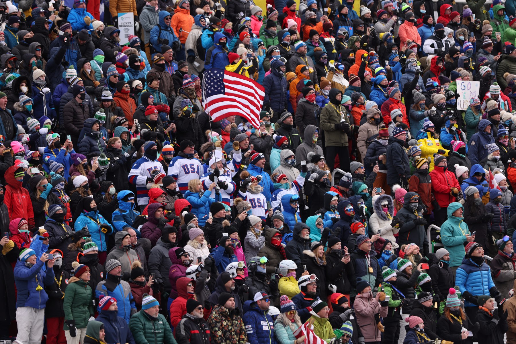 Packed Killington grandstand, USA flags flying