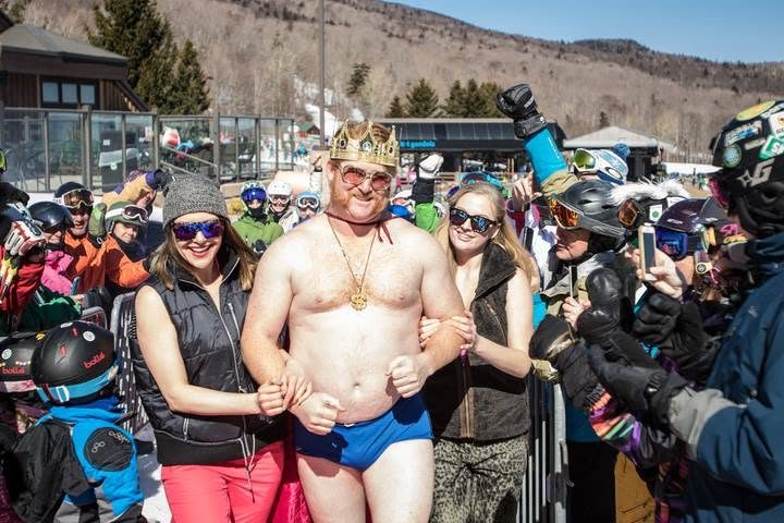 The King arm-in-arm with fans in the sunny finish-line crowd
