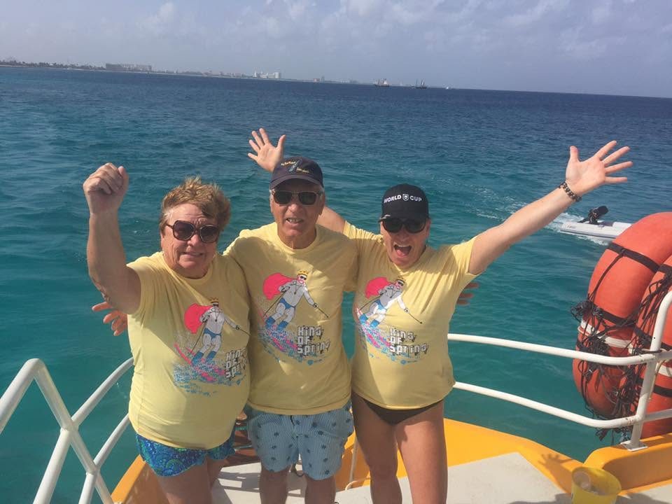 Fans in King of Spring shirts waving from a ferry deck